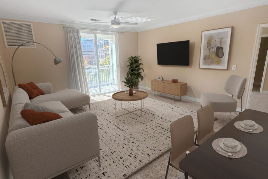 Attain Downtown East apartment homes with Modern living room with beige sofa, TV, dining table, floor lamp, plant, and large window letting in natural light.